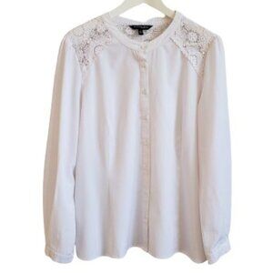 White blouse with lace shoulder detail